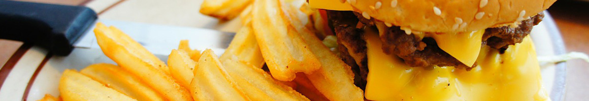 Eating Burger at Bay Burger Inn-Praus Haus restaurant in Coos Bay, OR.